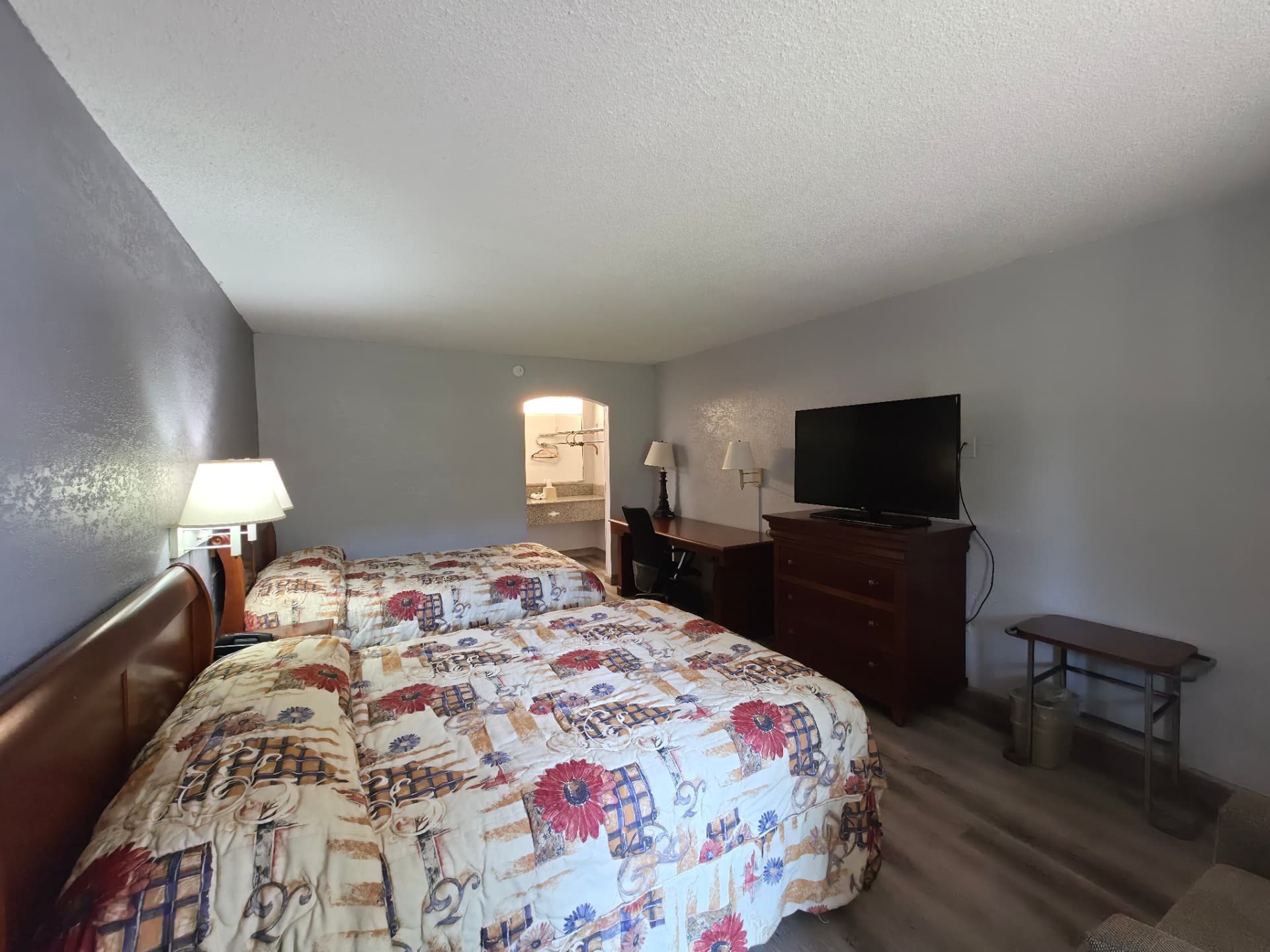 2 Beds Full Size room with two full beds, work desk, dresser and flat-screen TV