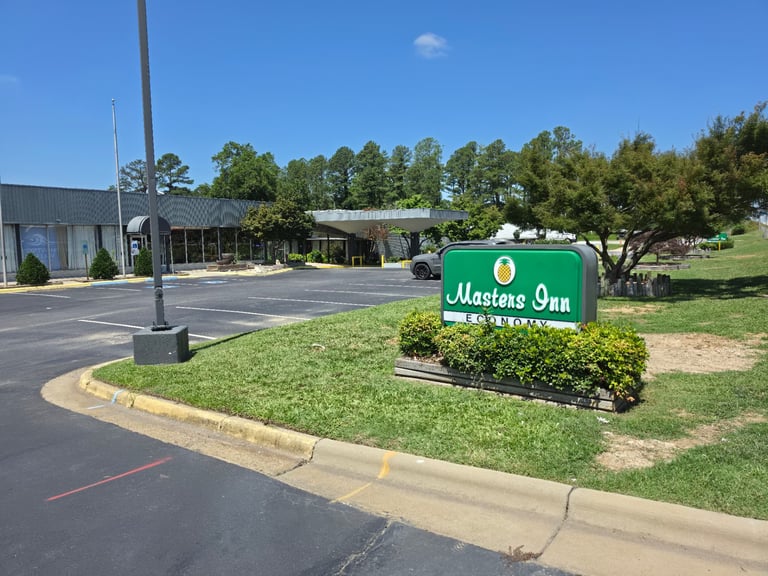 The covered drive-up entrance and parking area at Masters Economy Inn, Selma NC
